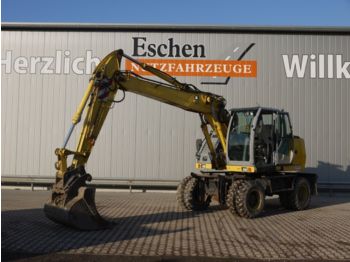 New Holland MH City  - Ratastel ekskavaator