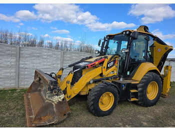 Ekskavaator-laadur CATERPILLAR