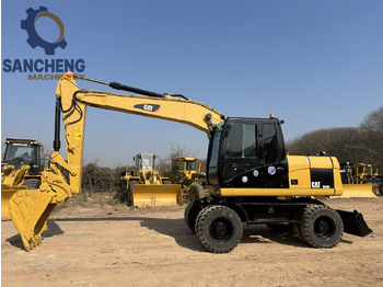 Ratastel ekskavaator CATERPILLAR M320