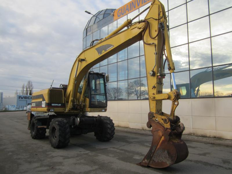 Caterpillar M315 - Ratastel ekskavaator: pilt 1 Caterpillar M315 - Ratastel ekskavaator: pilt 1