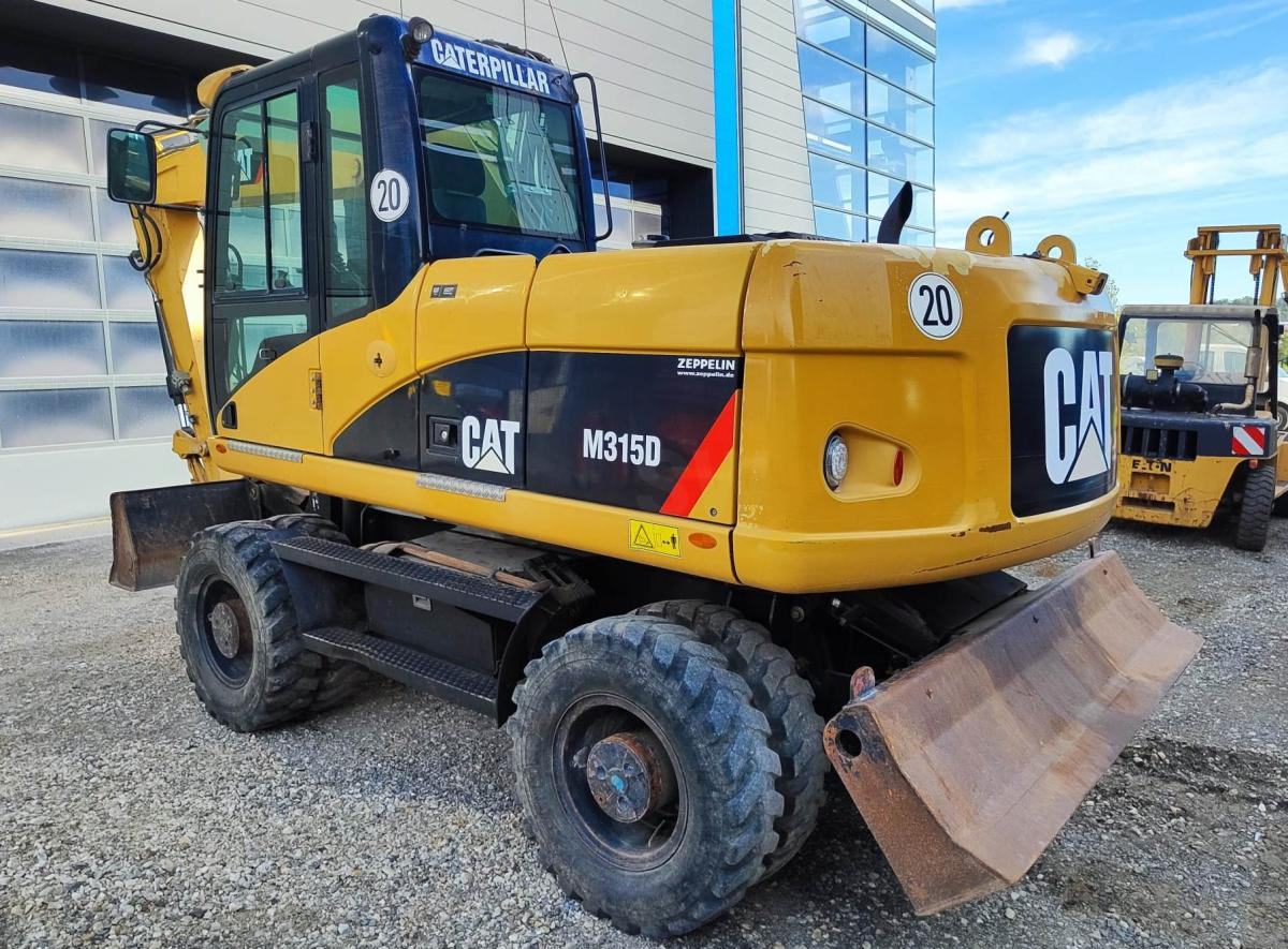 Caterpillar M315D - Ratastel ekskavaator: pilt 1 Caterpillar M315D - Ratastel ekskavaator: pilt 1