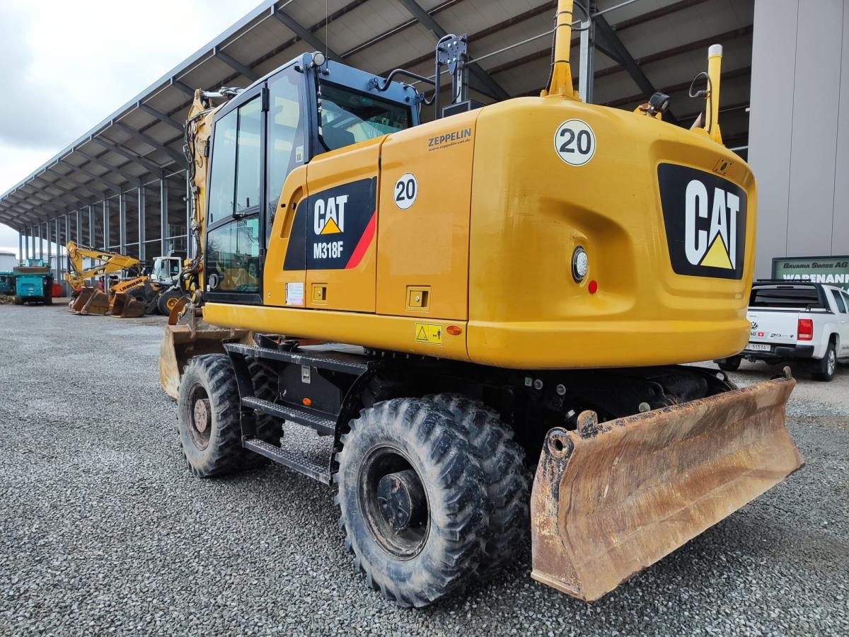 Caterpillar M318F - Ratastel ekskavaator: pilt 1 Caterpillar M318F - Ratastel ekskavaator: pilt 1