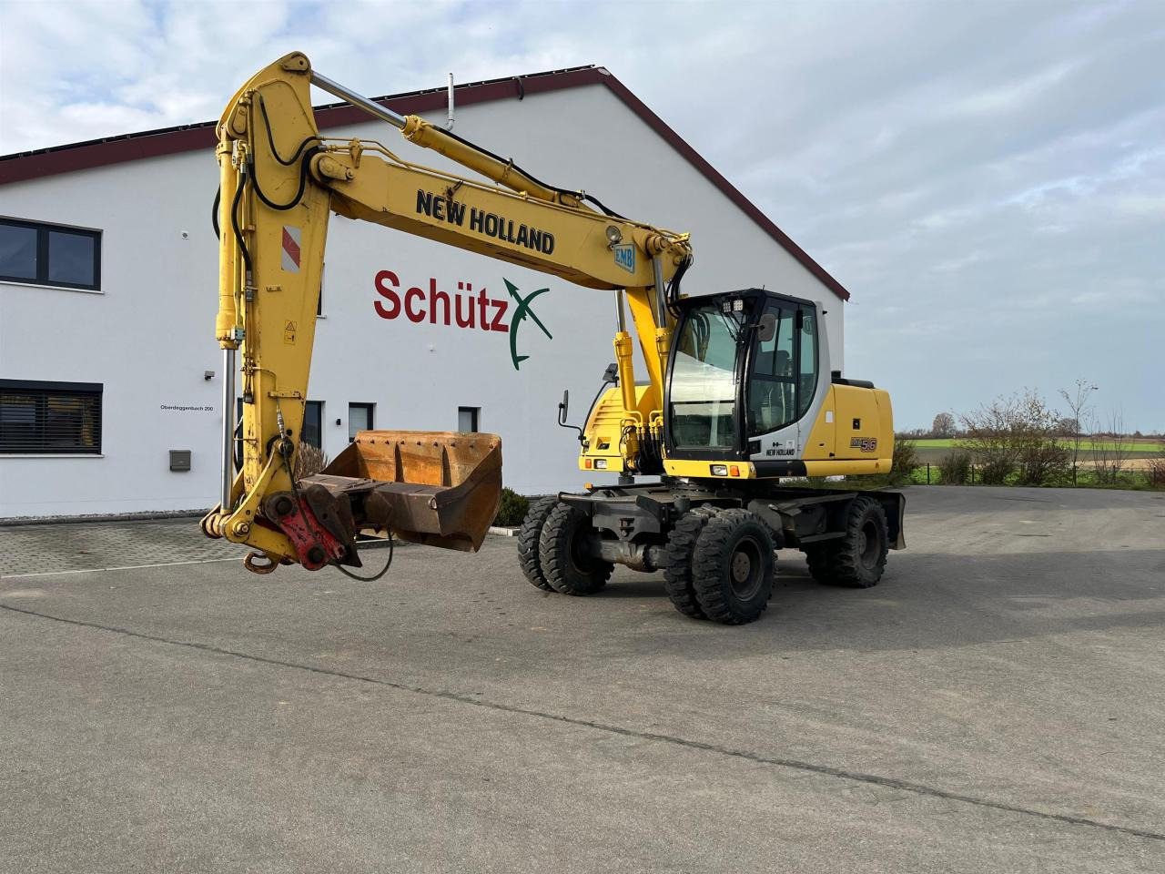 New Holland MH 5.6 inkl. Grabenlöffel, Tieflöffel - Ratastel ekskavaator: pilt 1 New Holland MH 5.6 inkl. Grabenlöffel, Tieflöffel - Ratastel ekskavaator: pilt 1