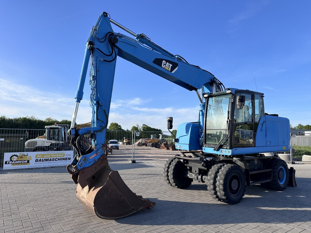 CATERPILLAR M 318 F Oil Quick OQ 65 Deutsche Maschine Top ! - Ratastel ekskavaator: pilt 3 CATERPILLAR M 318 F Oil Quick OQ 65 Deutsche Maschine Top ! - Ratastel ekskavaator: pilt 3