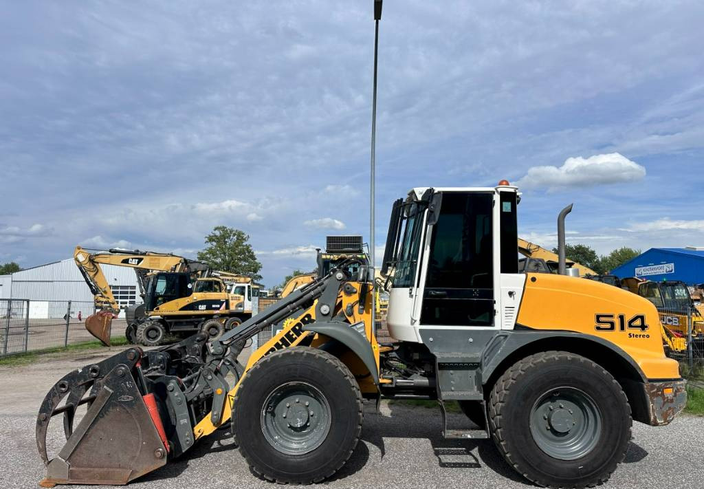 Liebherr L 514 Stereo +30 Kmh Klima 3er Kreis Greifschaufel - Rataslaadur: pilt 1 Liebherr L 514 Stereo +30 Kmh Klima 3er Kreis Greifschaufel - Rataslaadur: pilt 1
