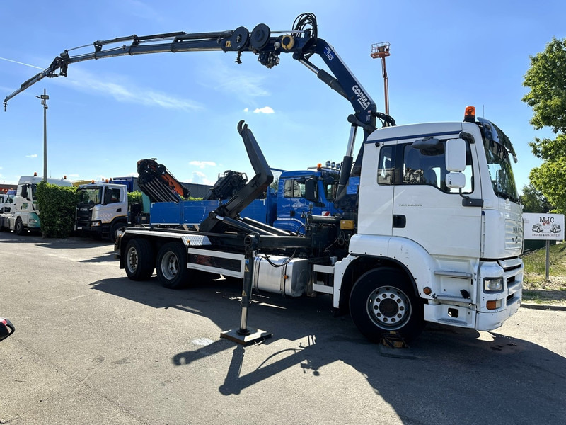 MAN TGA 26.310 6X2 HOOKLIFT + CRANE COPMA 160.4 + JIB J2 + WINCH - RADIO - LIFT + STEERING AXLE - EURO 3 - BE - Konkstõstukiga veoauto, Kraanaga veoauto: pilt 1 MAN TGA 26.310 6X2 HOOKLIFT + CRANE COPMA 160.4 + JIB J2 + WINCH - RADIO - LIFT + STEERING AXLE - EURO 3 - BE - Konkstõstukiga veoauto, Kraanaga veoauto: pilt 1