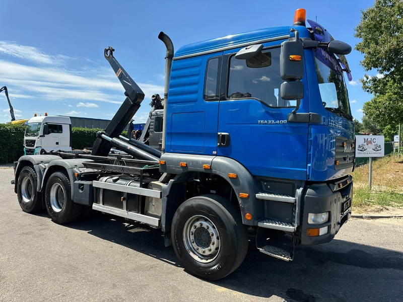 MAN TGA 33.400 6X4 HOOKLIFT AJK NHS20-4930mm - WB 3m60 - MANUAL ZF - STEEL SPRING / BLATT - BIG AXLES / AP ACHSEN - Konkstõstukiga veoauto: pilt 1 MAN TGA 33.400 6X4 HOOKLIFT AJK NHS20-4930mm - WB 3m60 - MANUAL ZF - STEEL SPRING / BLATT - BIG AXLES / AP ACHSEN - Konkstõstukiga veoauto: pilt 1