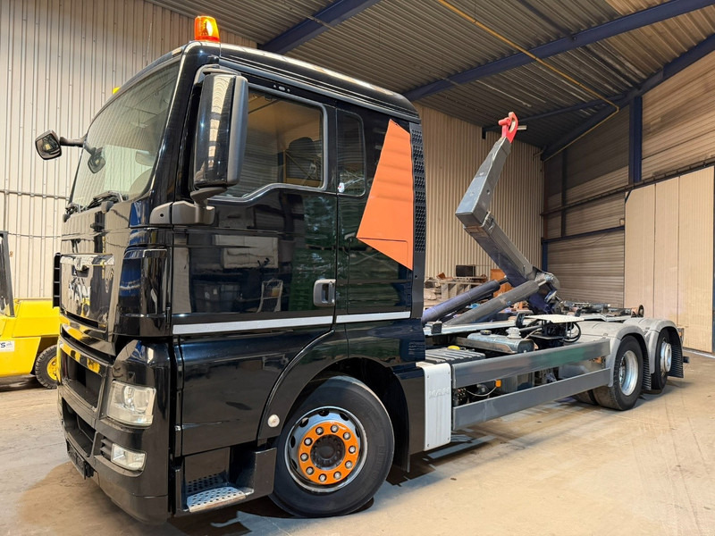 MAN TGX 26.400 6X2 + HOOKLIFT PALIFT 20T - LIFT + STEERING AXLE - EURO 5 - SLEEPERCAB - BE TRUCK - Konkstõstukiga veoauto: pilt 1 MAN TGX 26.400 6X2 + HOOKLIFT PALIFT 20T - LIFT + STEERING AXLE - EURO 5 - SLEEPERCAB - BE TRUCK - Konkstõstukiga veoauto: pilt 1