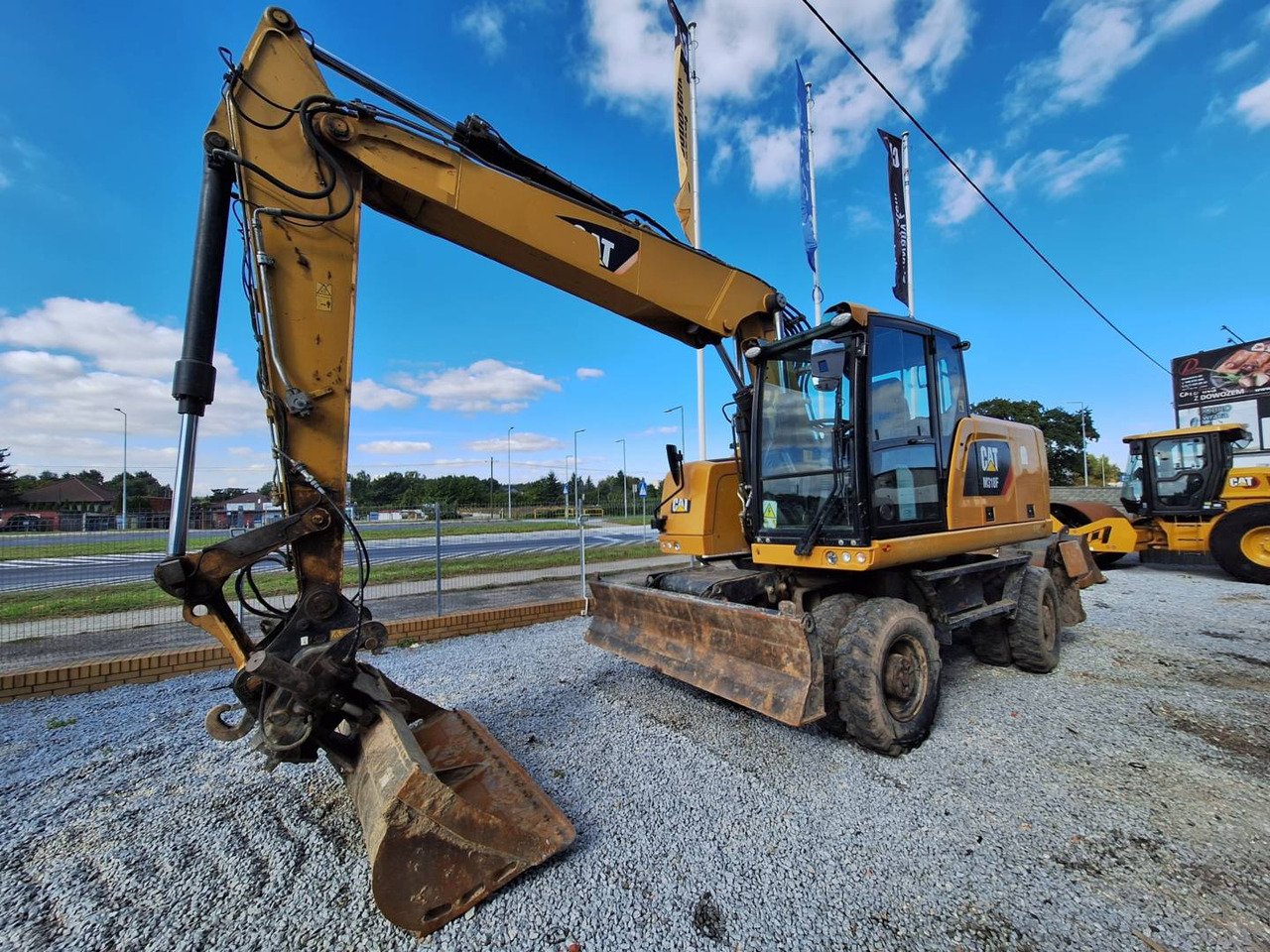 CAT M318F - Ratastel ekskavaator: pilt 1 CAT M318F - Ratastel ekskavaator: pilt 1