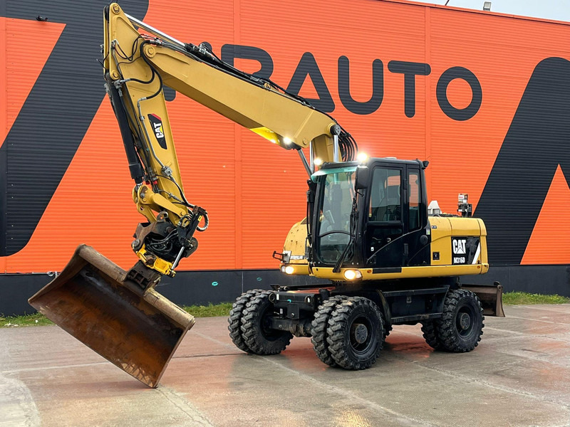Caterpillar M316D / ROTOTILT/ AC / CENTRAL LUBRICATION / + EXTRA BUCKET - Ratastel ekskavaator: pilt 1 Caterpillar M316D / ROTOTILT/ AC / CENTRAL LUBRICATION / + EXTRA BUCKET - Ratastel ekskavaator: pilt 1