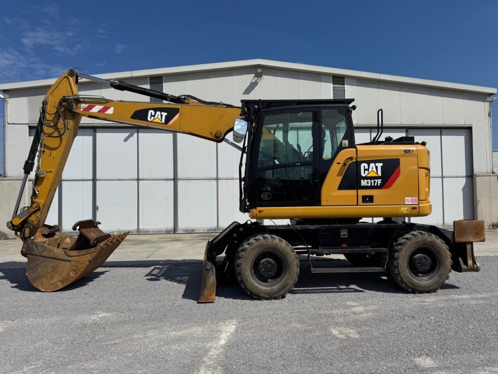 Caterpillar M317F - Ratastel ekskavaator: pilt 1 Caterpillar M317F - Ratastel ekskavaator: pilt 1