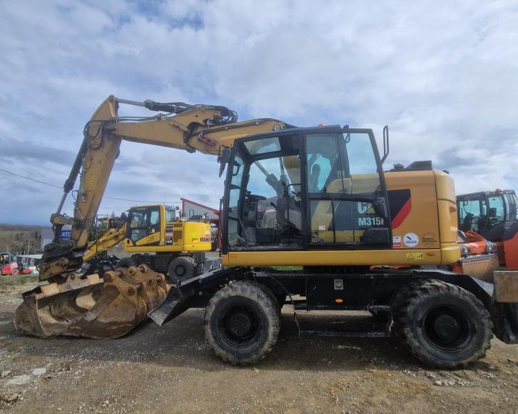 Caterpillar M315F F - Ratastel ekskavaator: pilt 1 Caterpillar M315F F - Ratastel ekskavaator: pilt 1