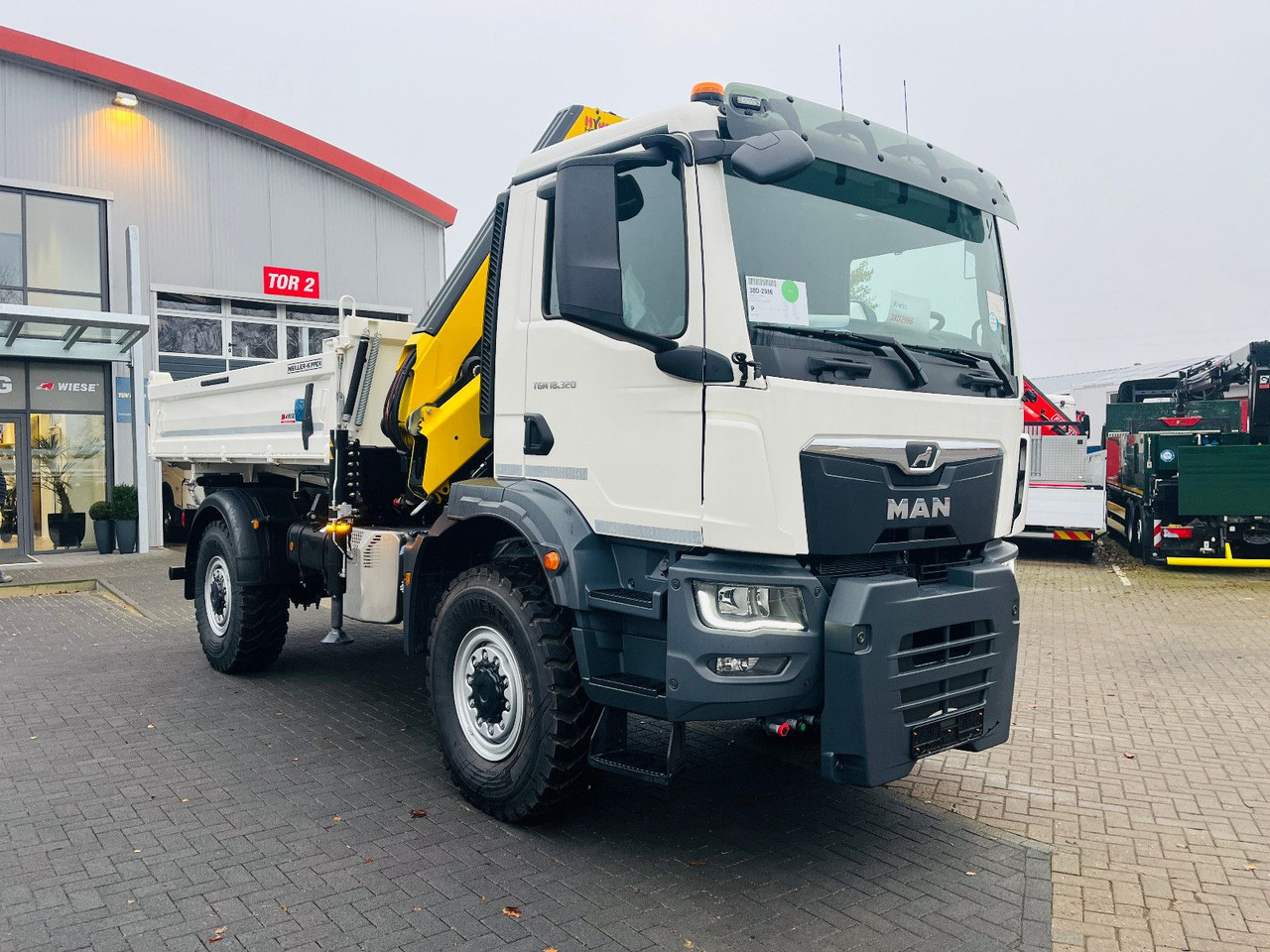 MAN TGM 18.320 4x4 BB Kipper Kran 131 Single Winter - Kraanaga veoauto: pilt 2 MAN TGM 18.320 4x4 BB Kipper Kran 131 Single Winter - Kraanaga veoauto: pilt 2