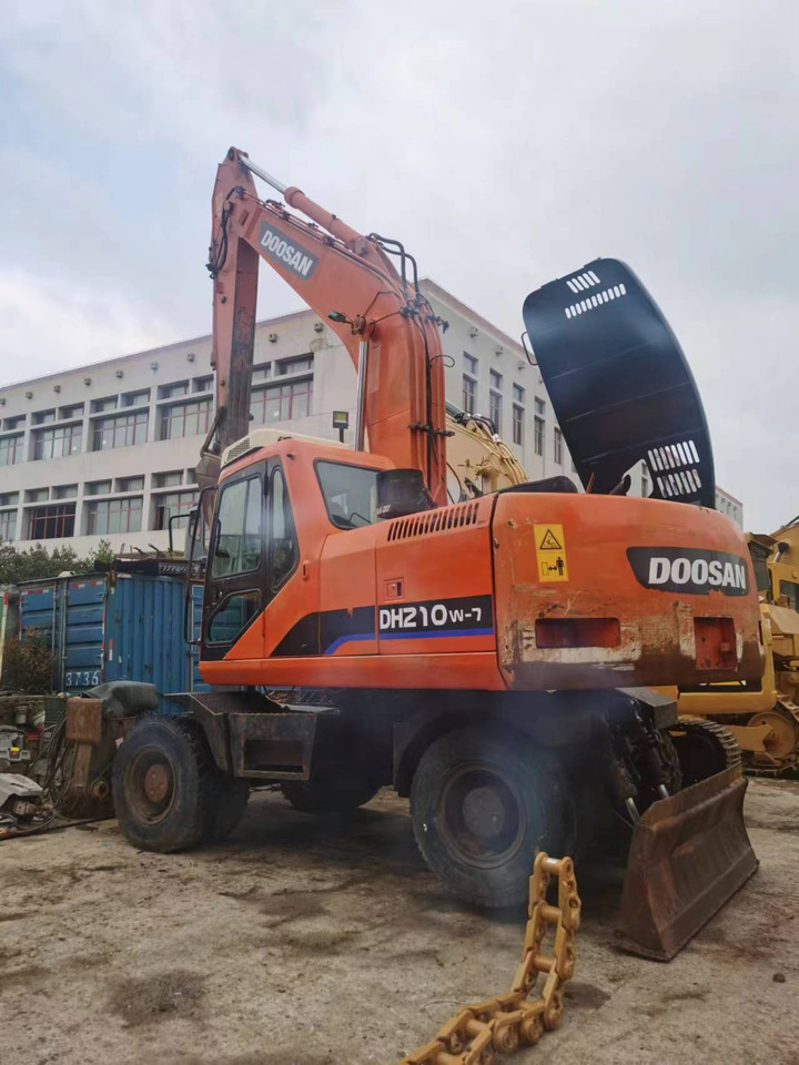 DOOSAN DH210W-7 - Ratastel ekskavaator: pilt 1 DOOSAN DH210W-7 - Ratastel ekskavaator: pilt 1