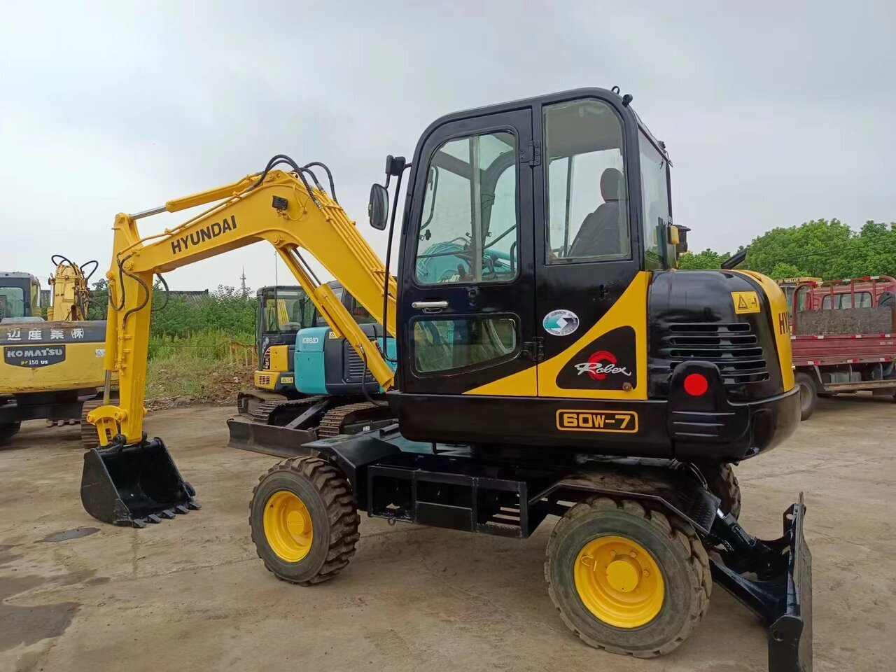 HYUNDAI 60W-7 - Ratastel ekskavaator: pilt 1 HYUNDAI 60W-7 - Ratastel ekskavaator: pilt 1