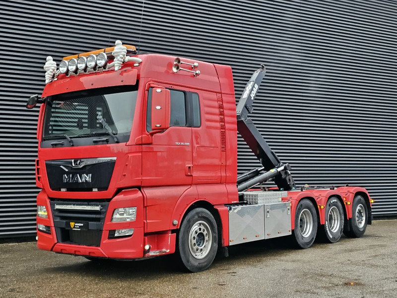 MAN TGX 35.500 / 8x4-4 / HOOKLIFT / ABROLL-KIPPER - Konkstõstukiga veoauto: pilt 1 MAN TGX 35.500 / 8x4-4 / HOOKLIFT / ABROLL-KIPPER - Konkstõstukiga veoauto: pilt 1