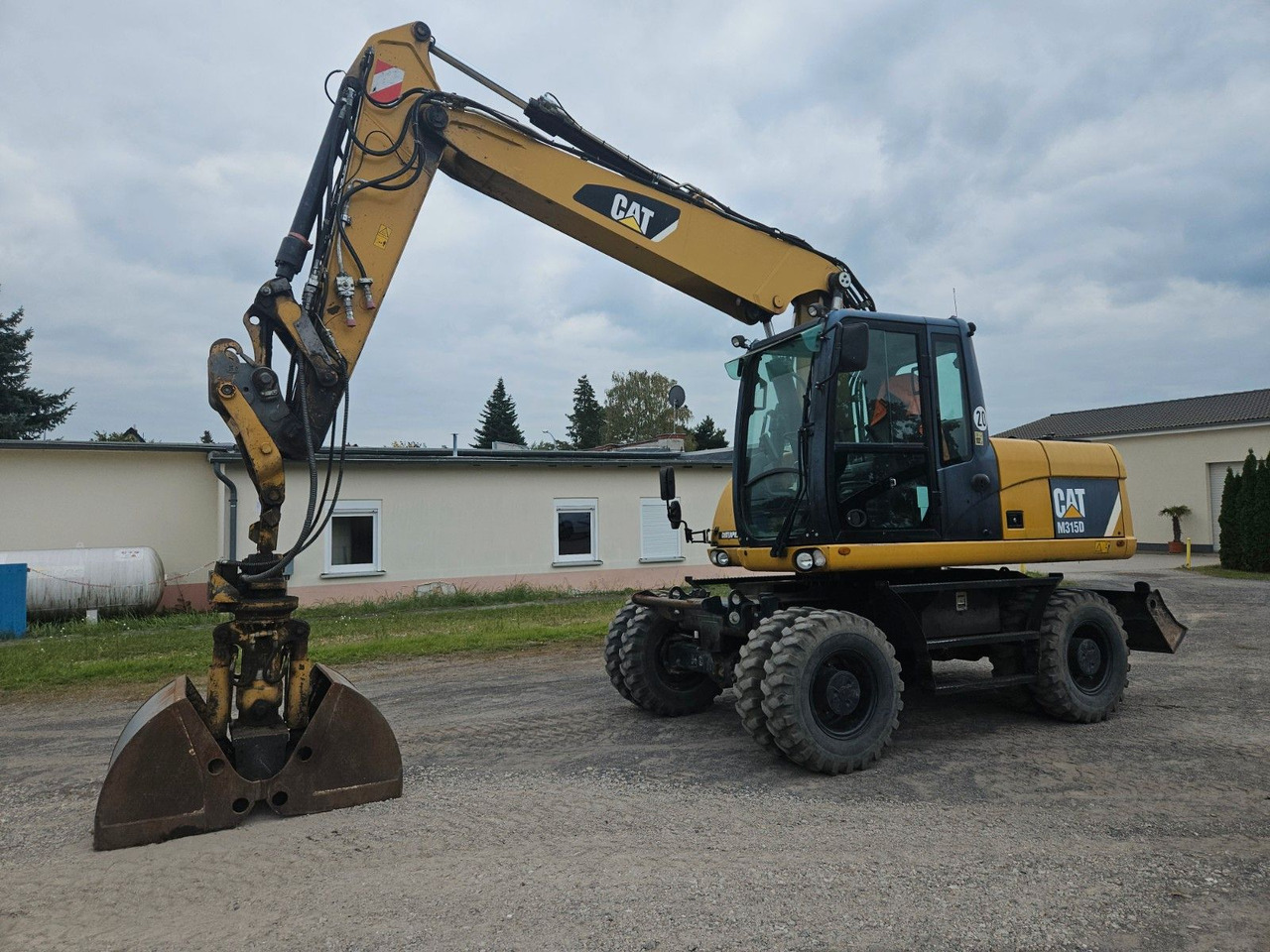 CAT M315D orig. 4.129h - Ratastel ekskavaator: pilt 1 CAT M315D orig. 4.129h - Ratastel ekskavaator: pilt 1
