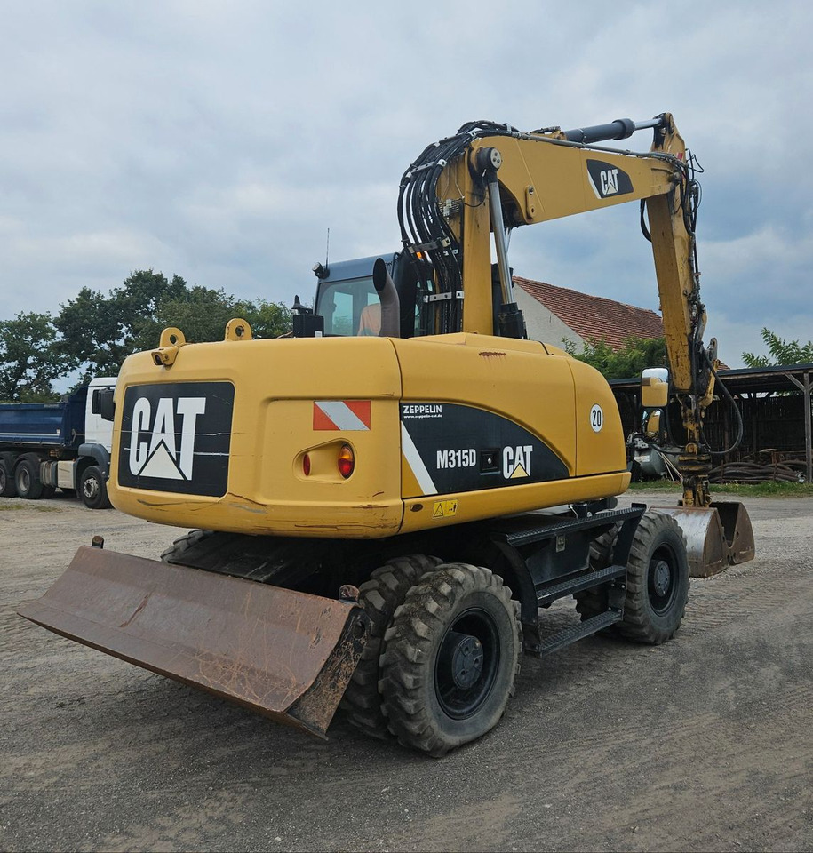 CAT M315D orig. 4.129h - Ratastel ekskavaator: pilt 2 CAT M315D orig. 4.129h - Ratastel ekskavaator: pilt 2