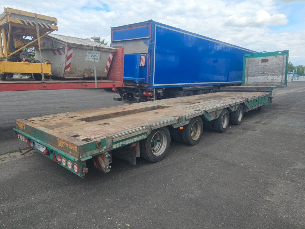 Meusburger MPG-4 Tieflader mit Radmulden 39.5t - Madal platvormpoolhaagis: pilt 1 Meusburger MPG-4 Tieflader mit Radmulden 39.5t - Madal platvormpoolhaagis: pilt 1