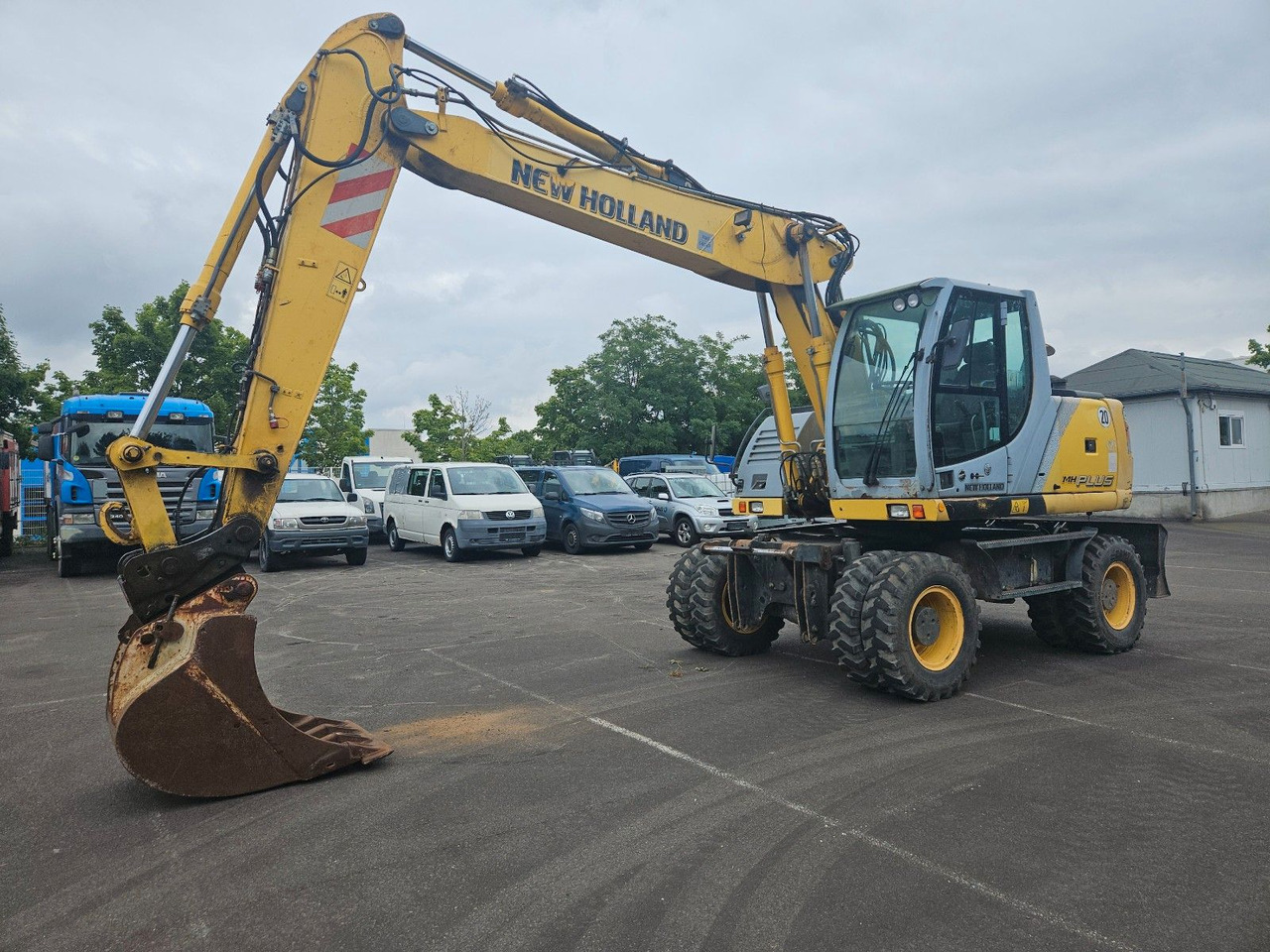 New Holland MH Plus 18t Mobilbagger - Ratastel ekskavaator: pilt 1 New Holland MH Plus 18t Mobilbagger - Ratastel ekskavaator: pilt 1