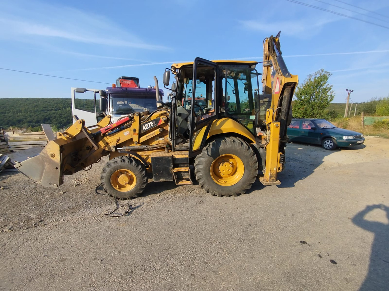 CATERPILLAR 472F2 - Ekskavaator-laadur: pilt 1 CATERPILLAR 472F2 - Ekskavaator-laadur: pilt 1