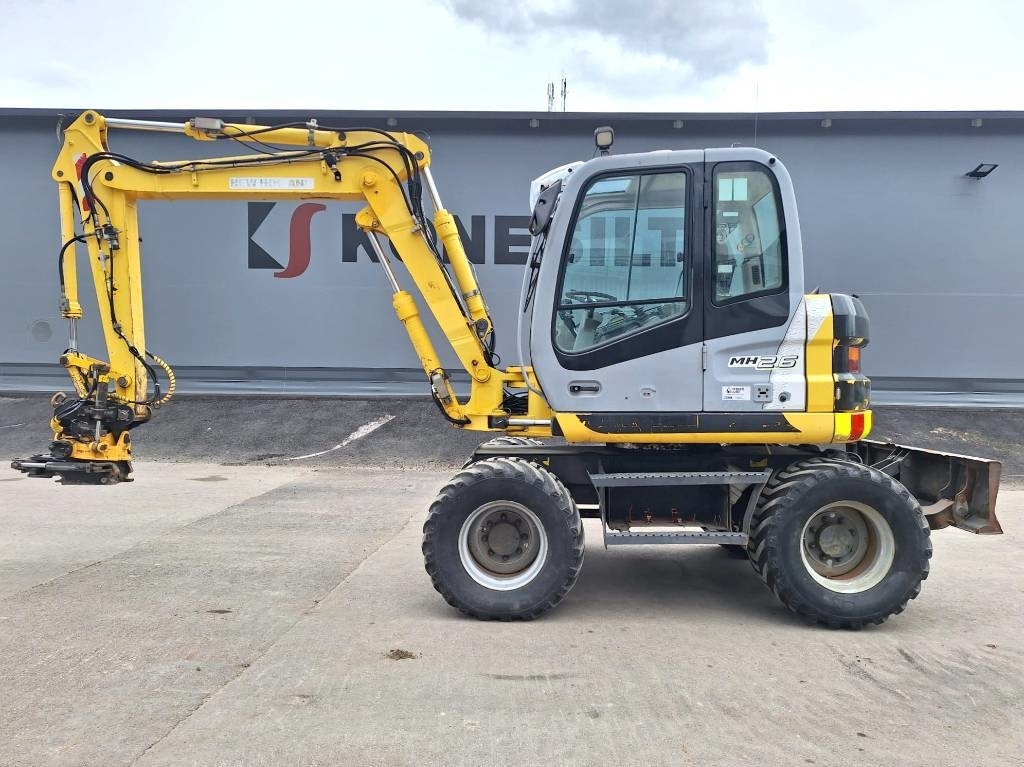 New Holland MH2.6 ENGCON PIHDEILLÄ - Ratastel ekskavaator: pilt 1 New Holland MH2.6 ENGCON PIHDEILLÄ - Ratastel ekskavaator: pilt 1