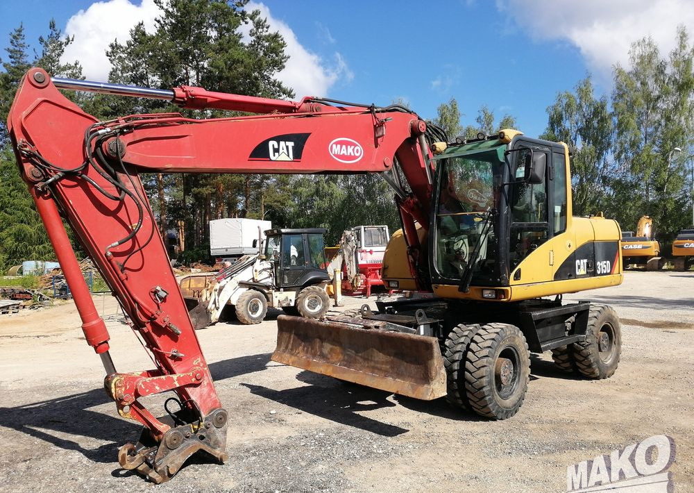 Caterpillar M315 C - Ratastel ekskavaator: pilt 1 Caterpillar M315 C - Ratastel ekskavaator: pilt 1