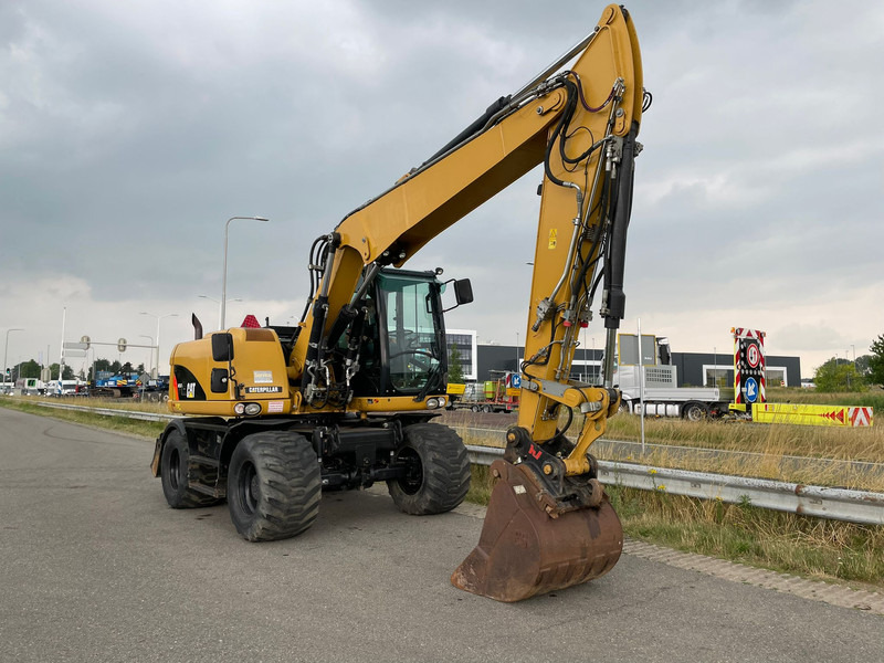 Ratastel ekskavaator Caterpillar M313D - CE: pilt 7