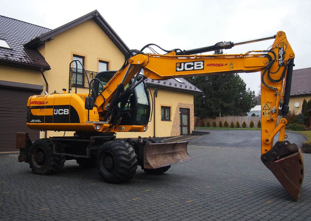Koparka kołowa JCB JS145W 2011 Koparka JCB - Ratastel ekskavaator: pilt 1 Koparka kołowa JCB JS145W 2011 Koparka JCB - Ratastel ekskavaator: pilt 1