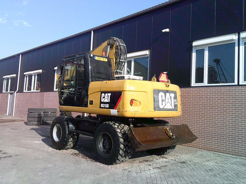 Caterpillar M315D - Ratastel ekskavaator: pilt 2 Caterpillar M315D - Ratastel ekskavaator: pilt 2