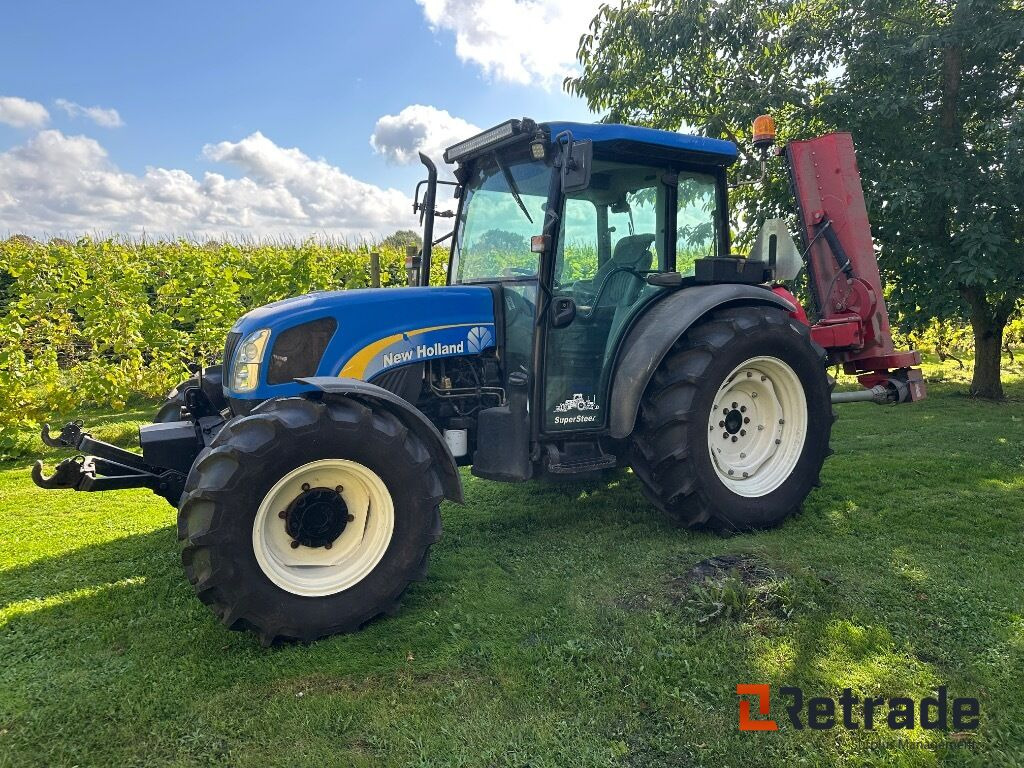 New Holland T4040 super steer traktor - Põllutööseade: pilt 1 New Holland T4040 super steer traktor - Põllutööseade: pilt 1
