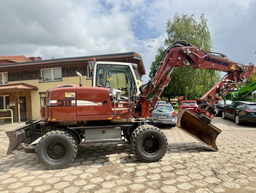 Liebherr A311 Litronic - Ratastel ekskavaator: pilt 1 Liebherr A311 Litronic - Ratastel ekskavaator: pilt 1