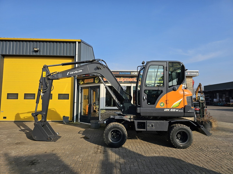 Develon DX60WN ECO-1 - Ratastel ekskavaator: pilt 1 Develon DX60WN ECO-1 - Ratastel ekskavaator: pilt 1