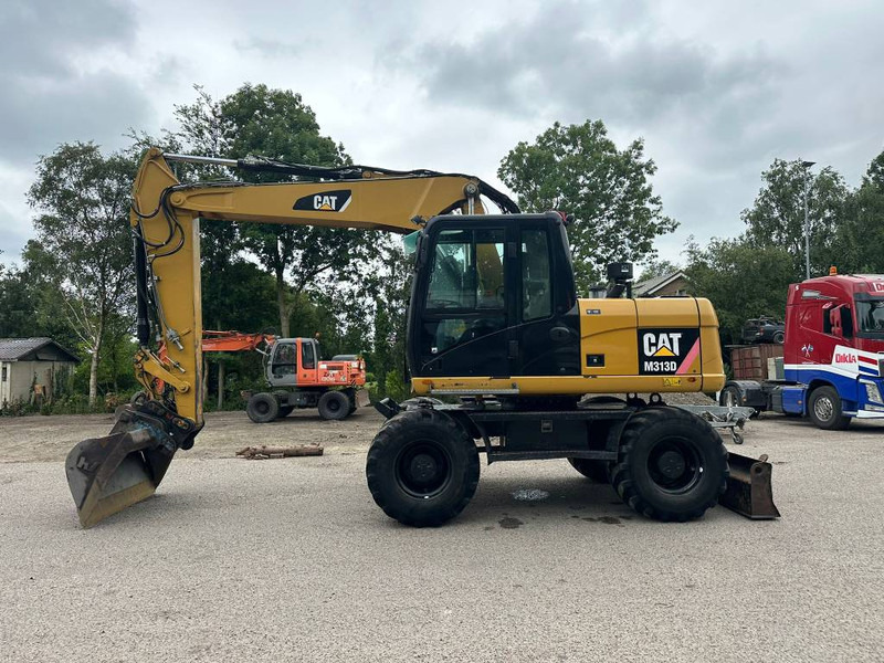 Cat M 313 D - Ratastel ekskavaator: pilt 1 Cat M 313 D - Ratastel ekskavaator: pilt 1