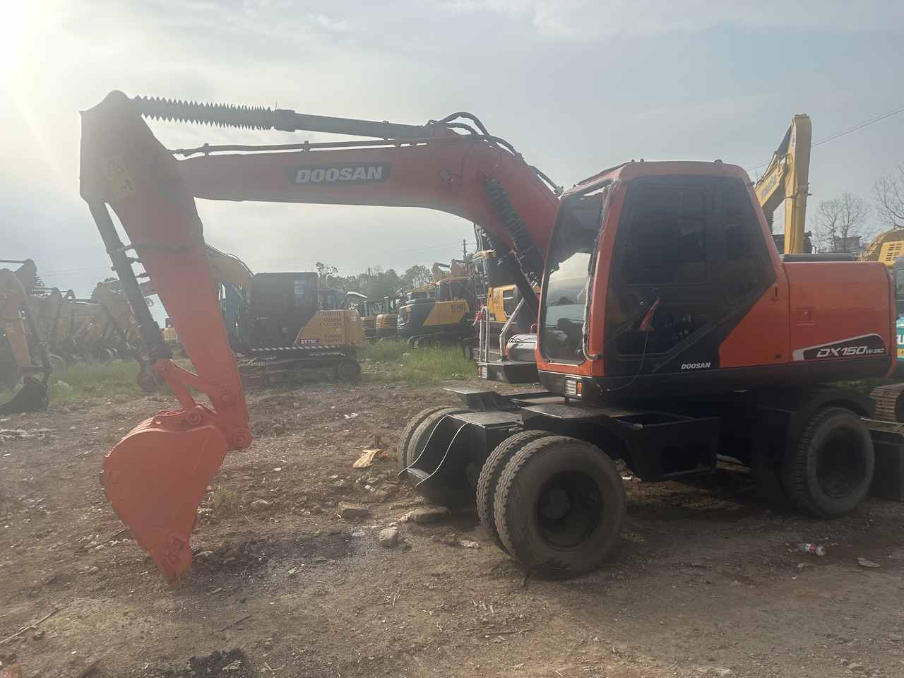 Doosan DX150W-9C - Ratastel ekskavaator: pilt 1 Doosan DX150W-9C - Ratastel ekskavaator: pilt 1