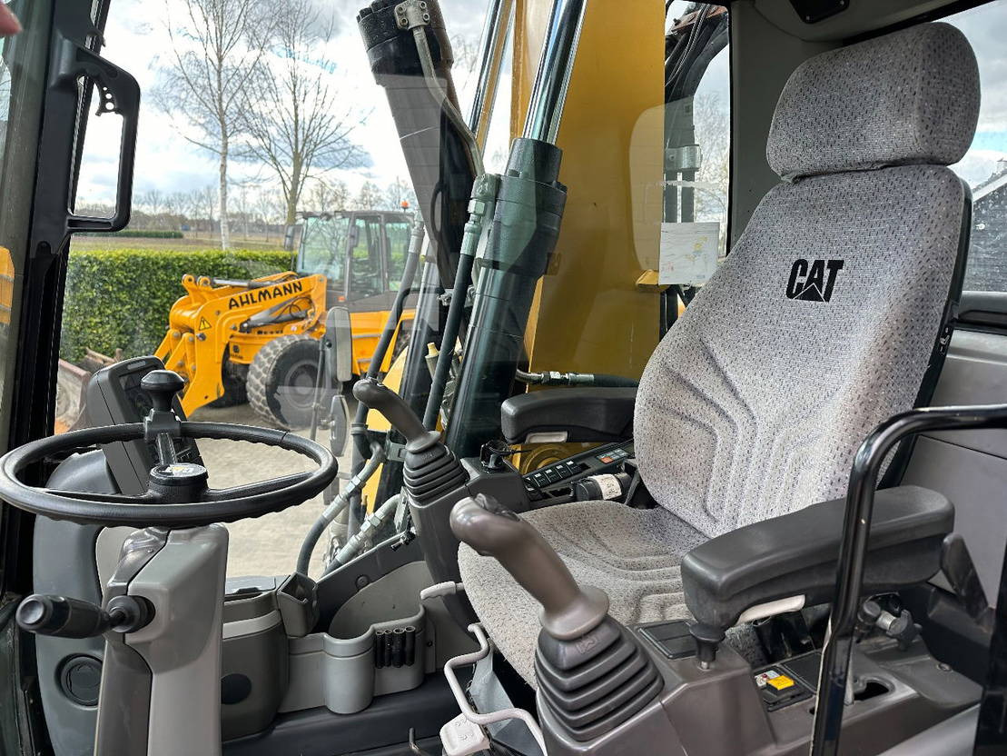 Ratastel ekskavaator Caterpillar M313D: pilt 12
