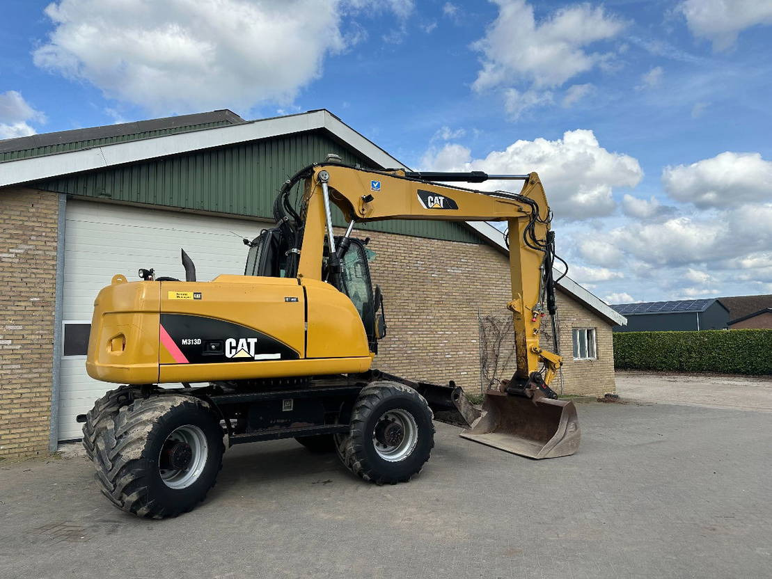 Ratastel ekskavaator Caterpillar M313D: pilt 6