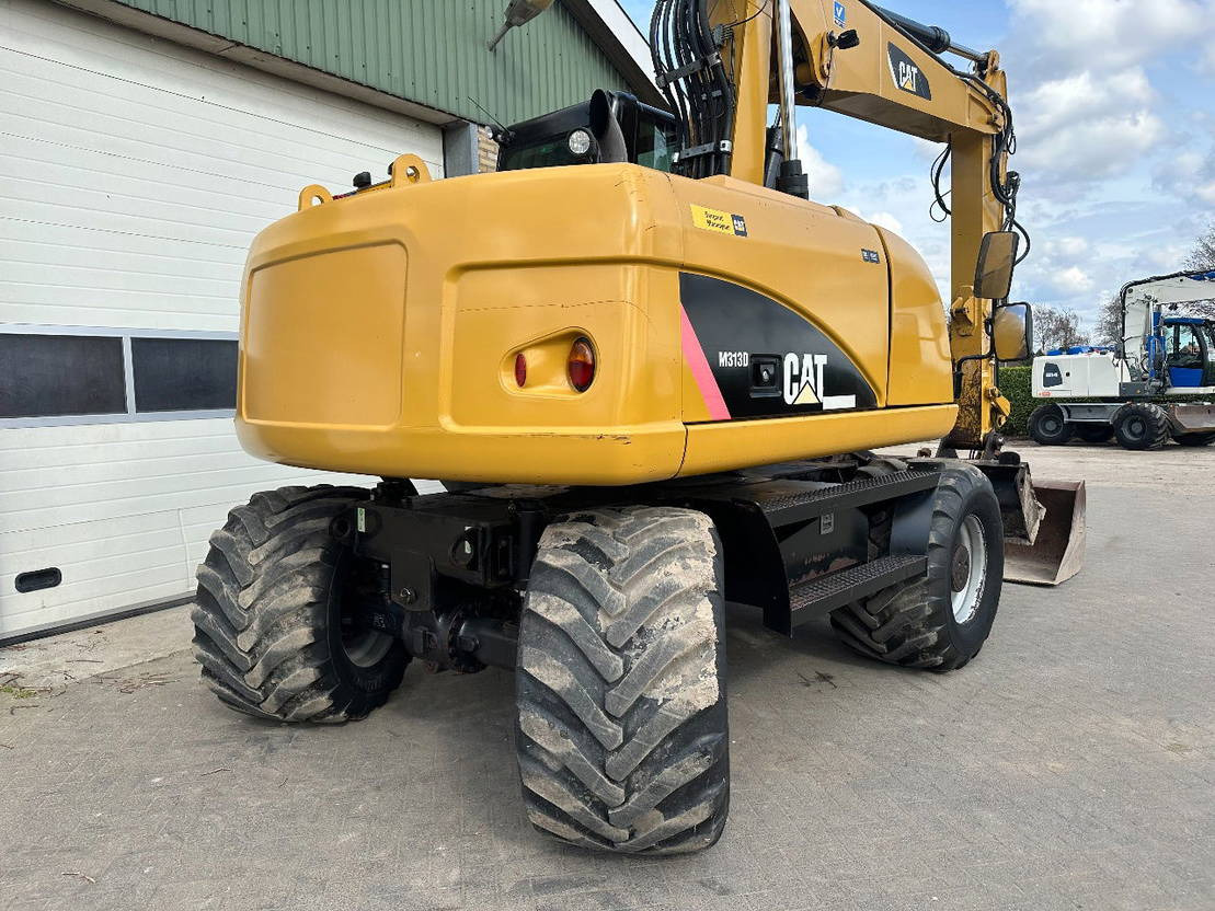 Ratastel ekskavaator Caterpillar M313D: pilt 9