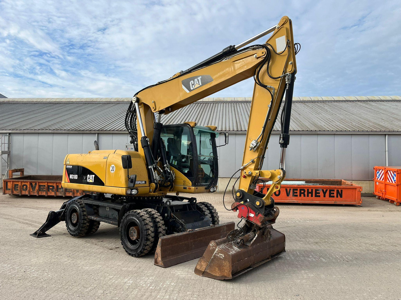 Caterpillar M318D - Ratastel ekskavaator: pilt 1 Caterpillar M318D - Ratastel ekskavaator: pilt 1