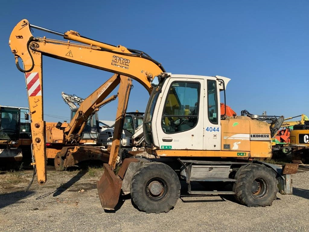 Liebherr A 312 - Ratastel ekskavaator: pilt 2 Liebherr A 312 - Ratastel ekskavaator: pilt 2