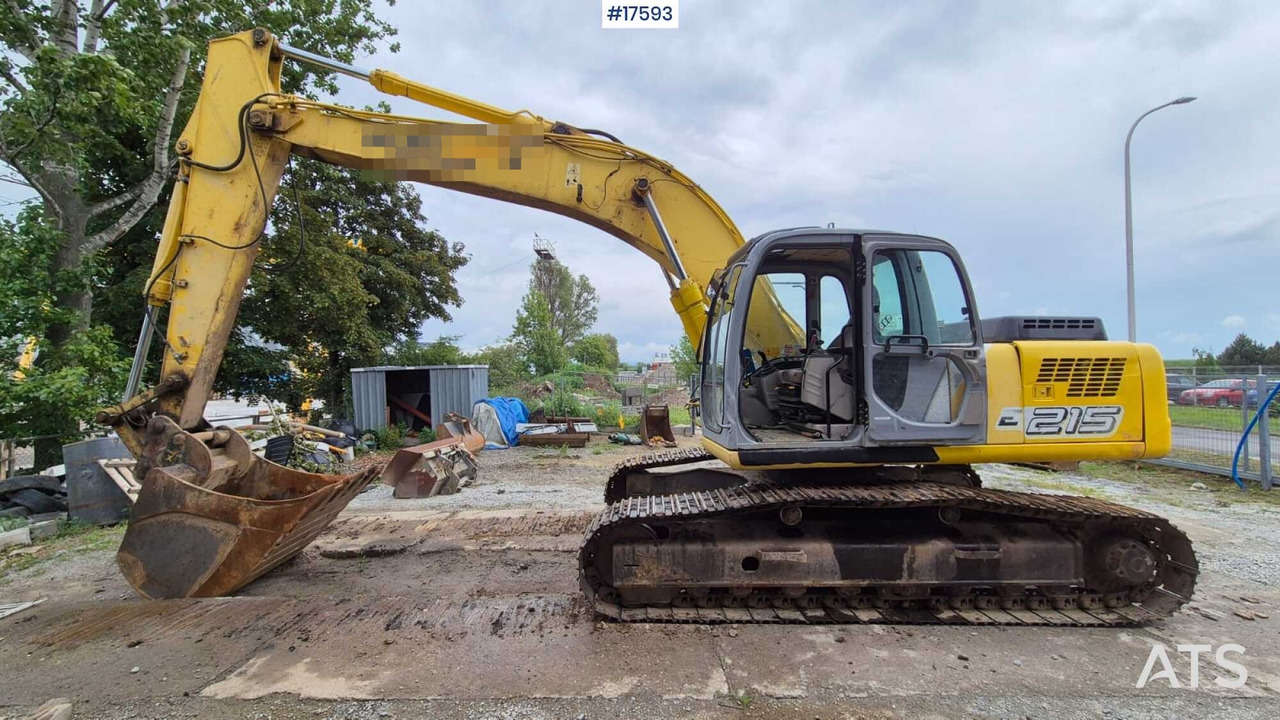 2005 New Holland E215 - Lintekskavaator: pilt 1 2005 New Holland E215 - Lintekskavaator: pilt 1