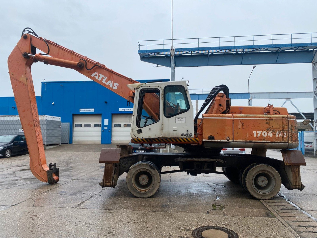 Atlas 1704 MI mit Greifer Umschlagbagger Lang - Ratastel ekskavaator: pilt 1 Atlas 1704 MI mit Greifer Umschlagbagger Lang - Ratastel ekskavaator: pilt 1