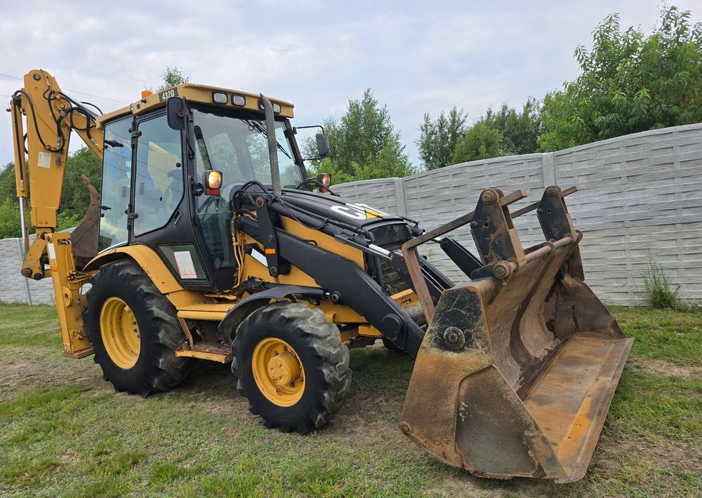 Caterpillar - Ekskavaator-laadur: pilt 2 Caterpillar - Ekskavaator-laadur: pilt 2