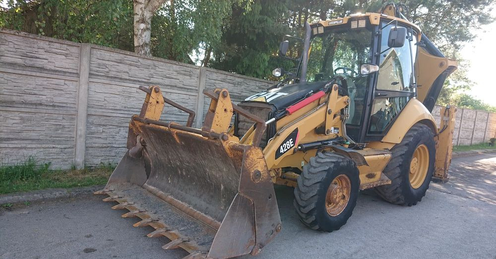 Caterpillar - Ekskavaator-laadur: pilt 1 Caterpillar - Ekskavaator-laadur: pilt 1
