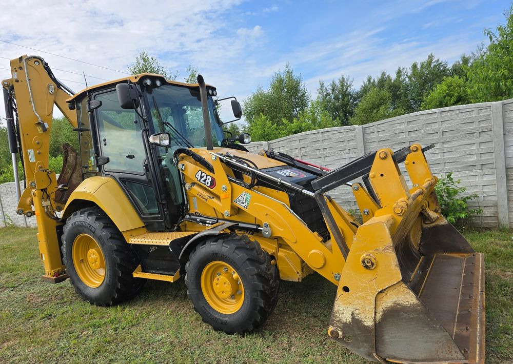 Caterpillar - Ekskavaator-laadur: pilt 1 Caterpillar - Ekskavaator-laadur: pilt 1