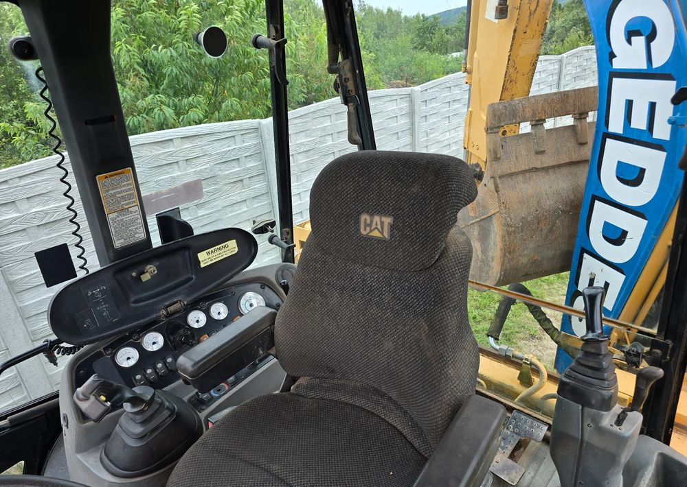 Caterpillar - Ekskavaator-laadur: pilt 3 Caterpillar - Ekskavaator-laadur: pilt 3