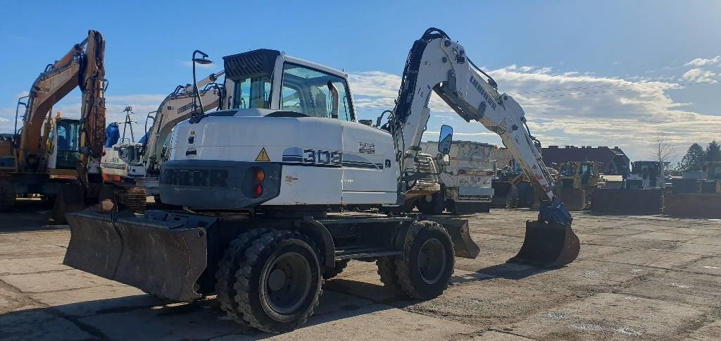 Liebherr A 309 Litronic - Ratastel ekskavaator: pilt 3 Liebherr A 309 Litronic - Ratastel ekskavaator: pilt 3
