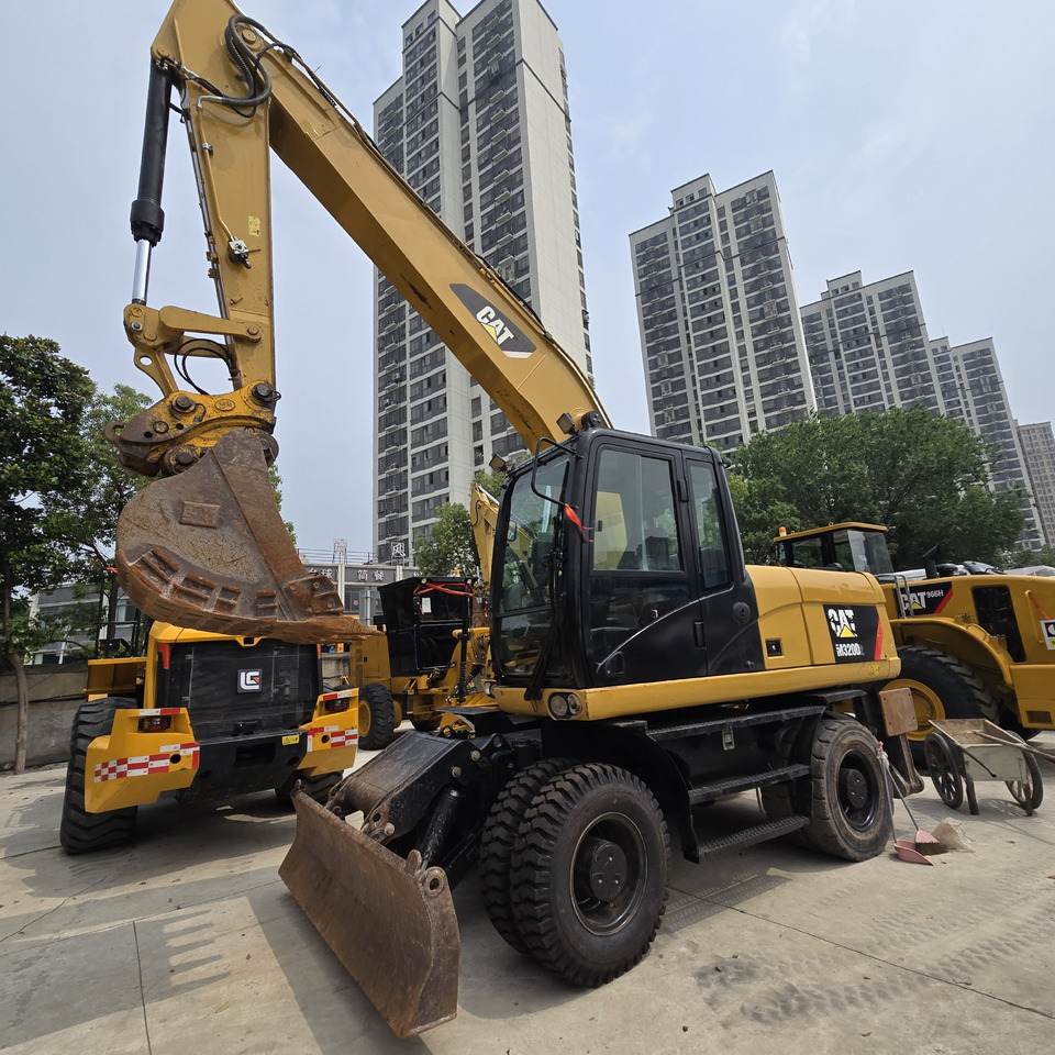 CAT M320D2 - Ratastel ekskavaator: pilt 1 CAT M320D2 - Ratastel ekskavaator: pilt 1