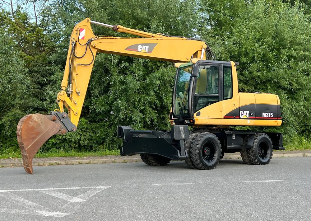 Caterpillar CAT M315C CATERPILLAR SPROWADZONY Bardzo Dobry Stan - Ratastel ekskavaator: pilt 1 Caterpillar CAT M315C CATERPILLAR SPROWADZONY Bardzo Dobry Stan - Ratastel ekskavaator: pilt 1