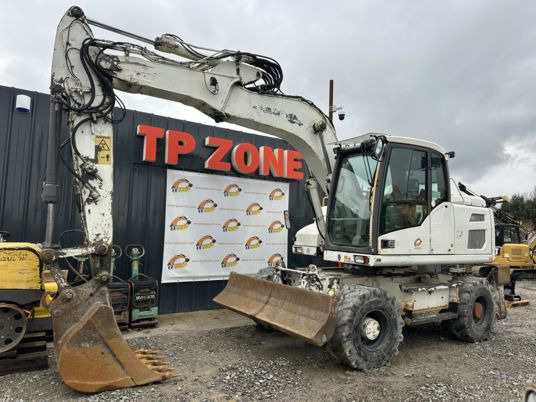 Volvo EW140D à 34900 € HT - Ratastel ekskavaator: pilt 1 Volvo EW140D à 34900 € HT - Ratastel ekskavaator: pilt 1